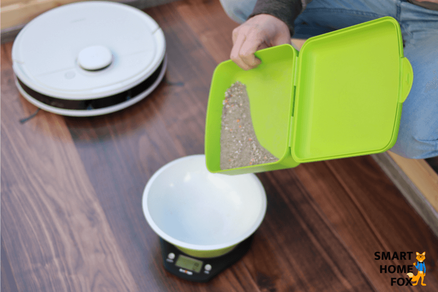 Weighing out dirt on a scale for the cleaning test